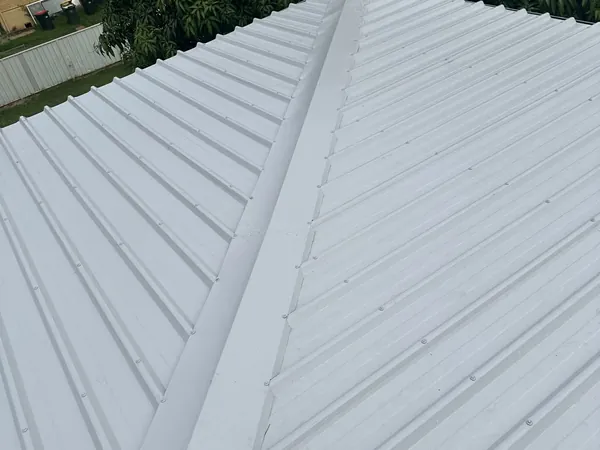 Newly laid pale grey COLORBOND roof sheeting and ridge capping