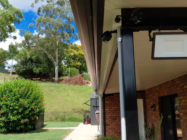 New grey COLORBOND gutter with slotted overflow and matching fascia on a brick home