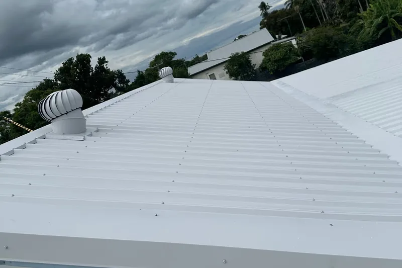Roof restoration work on a tired tile roof being brought back to a sealed finish